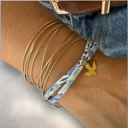 Bracelet femme cordon liberty bleu avec hirondelle en acier inoxydable doré