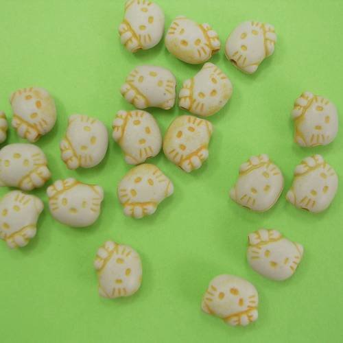 Lot de 20 perles plastiques : chat jaune 9mm 